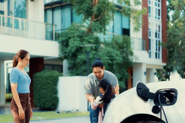 Focus home charging station for EV car blur progressive family in background