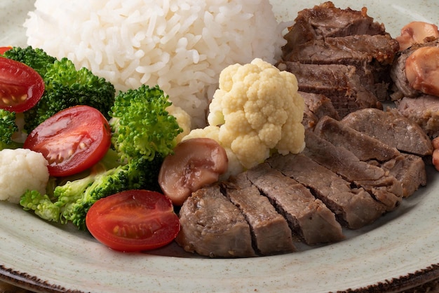 Focus on tenderloin steak rice and salad plate