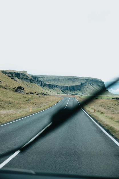 Focus on view from inside camper van on amazing cinematic scandinavian landscape Travel on epic road trip through mountainsvanlife lifestyle Life on the road