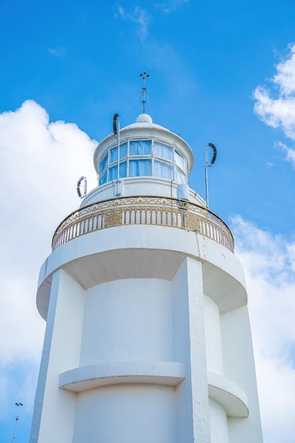 Focus white Lighthouse in Vung Tau The most visited tourist location in the Vung Tau city and famous Lighthouse captured with blue sky and cloud