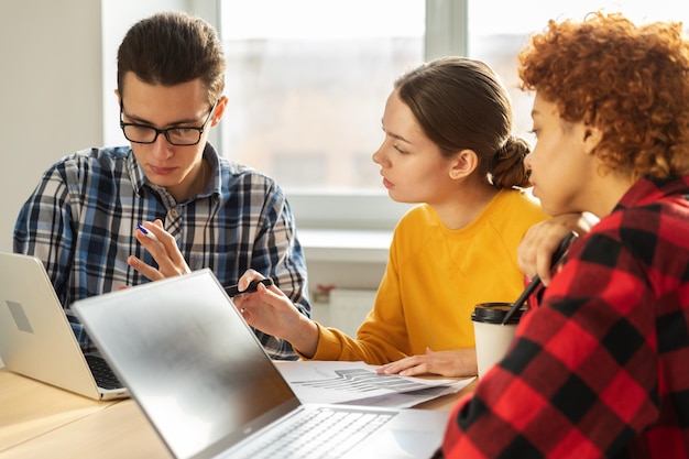 Focused female team leader discuss financial statistics brainstorming business meeting with partners