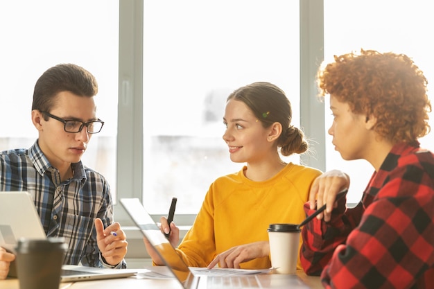 Focused female team leader discuss financial statistics brainstorming business meeting with partners