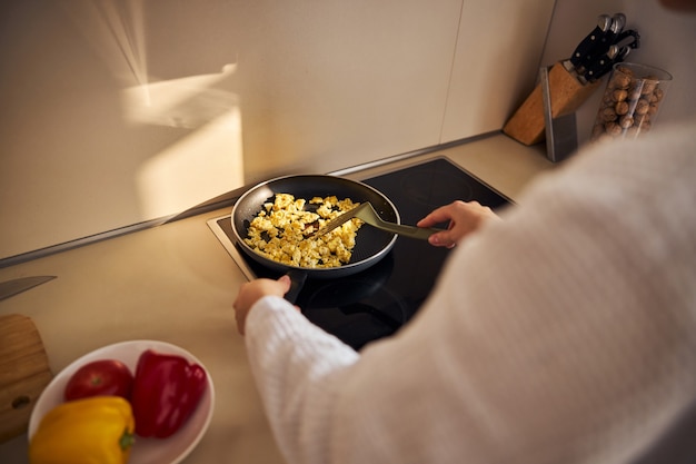 Focused photo on woman that cooking dinner