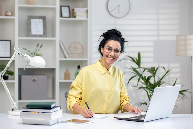 A focused professional working diligently in a bright and wellorganized home office setting