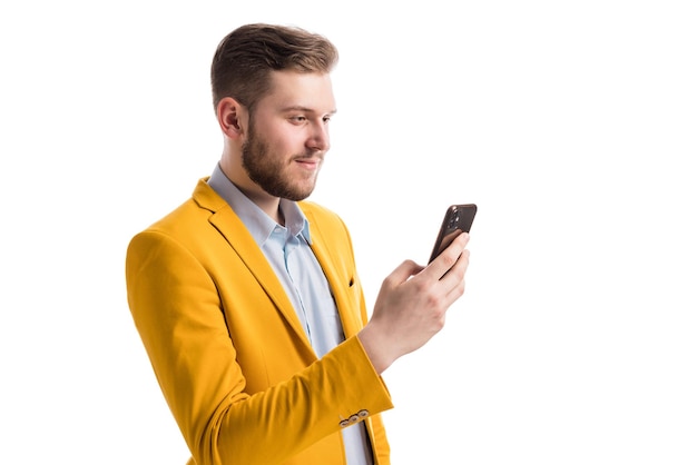 Focused successful male holding mobile phone