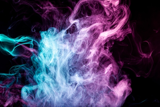 Fog colored with bright pink smoke on dark background