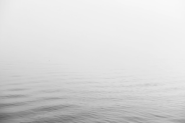 Fog in the lake. Morning nature water and white fog.