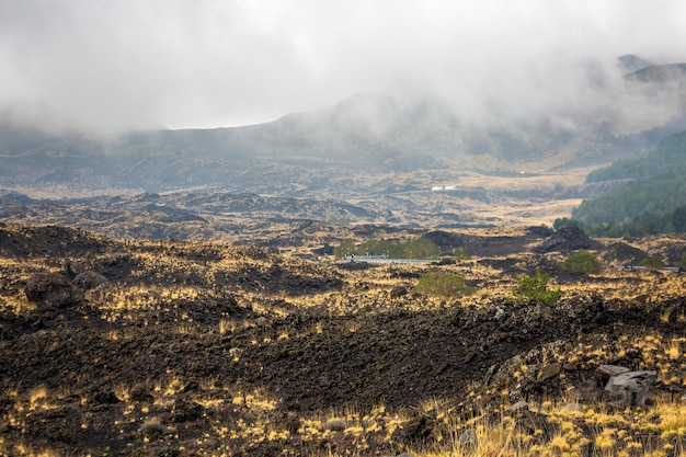 Fog over peak of the mount Etna in Catania Sicily, Italy.