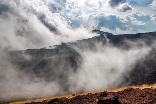 Fog over peak of the mount Etna in Catania Sicily, Italy.