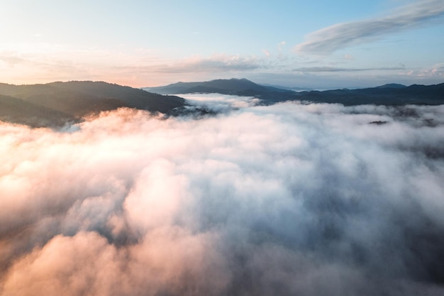 Fog with mountains and light in the morning