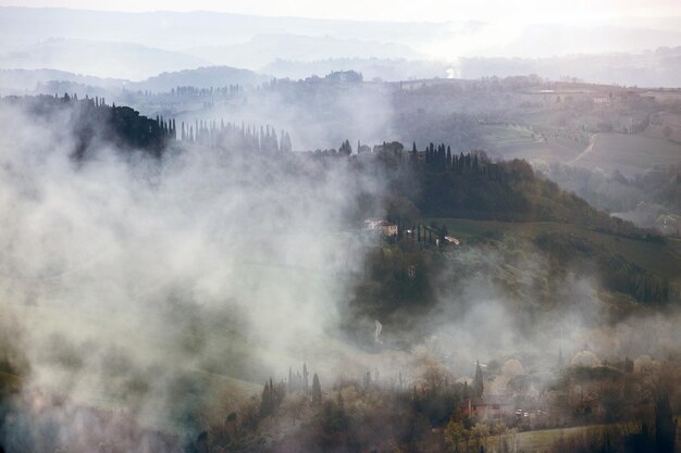 Foggy morning at the Toscana with the rising sun beams