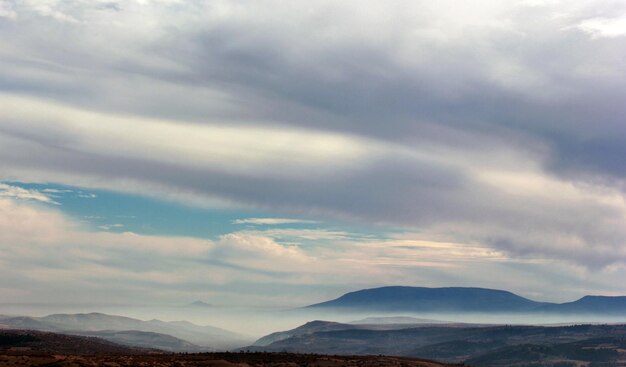 Foggy mountain and clouds in the sky