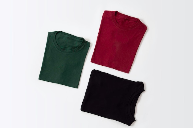 Folded black dark red and green tshirt with white background