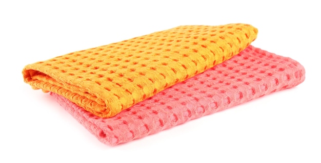 Folded colorful kitchen towels on white background