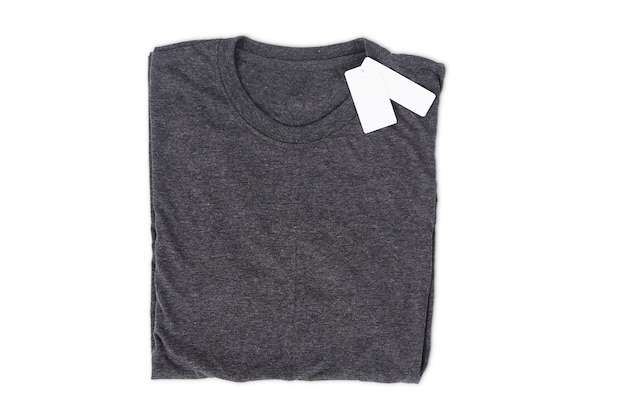 Folded t-shirt with tag isolate on white background with clipping path for design mockup