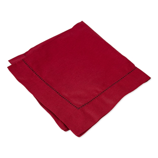 Folded wine red tissue napkin isolated over white background