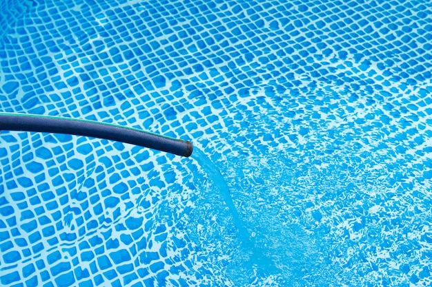 The folding pool is filled with water from a hose clean tap water for the pool