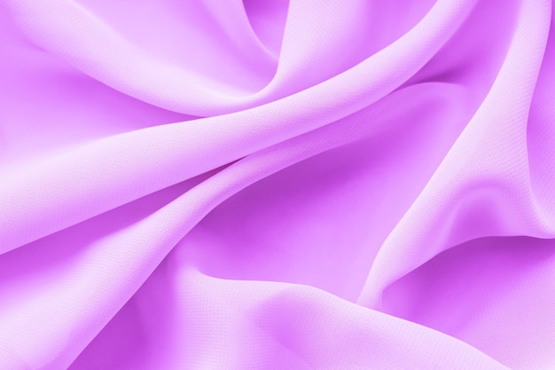 folds of purple silk fabric texture background