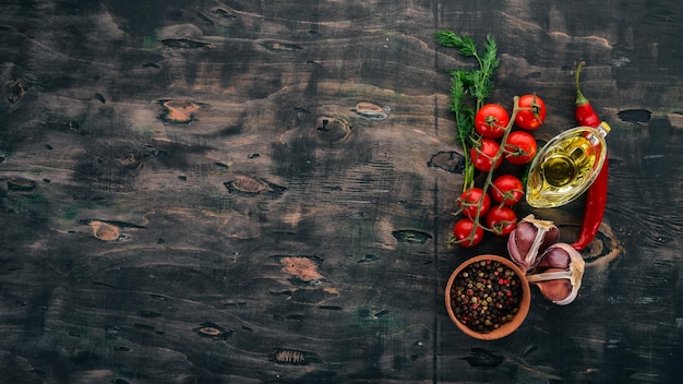 Food Background Cherry tomatoes spices and sauces Top view On a wooden background Free space for text