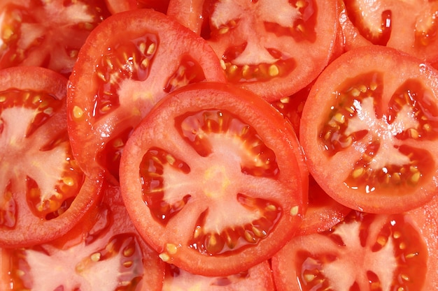 Food background circles slices red raw tomato close-up