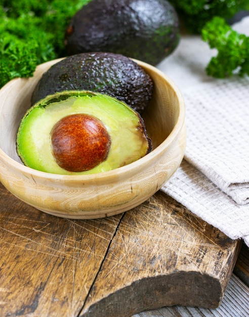 Food background with fresh organic avocado