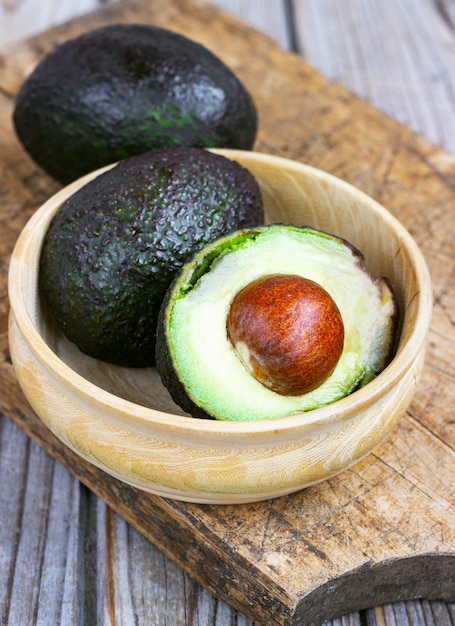 Food background with fresh organic avocado