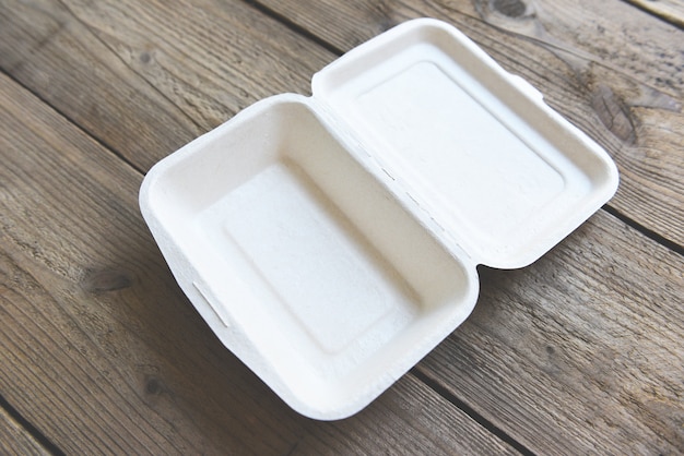 Food box take away boxes, disposable eco friendly packaging containers on wooden table at home