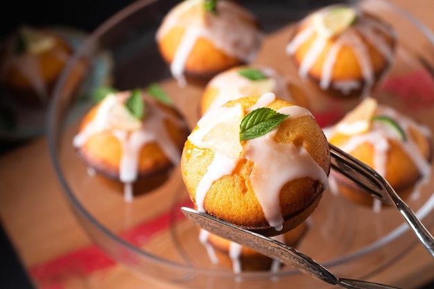 Food Concept Homemade organic mini Lemon cake on wooden board with black copy space