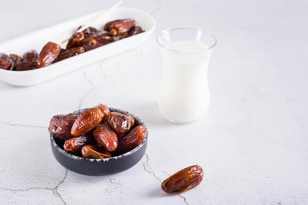 Food for the holy month of Ramadan Dates in a bowl and milk on the table