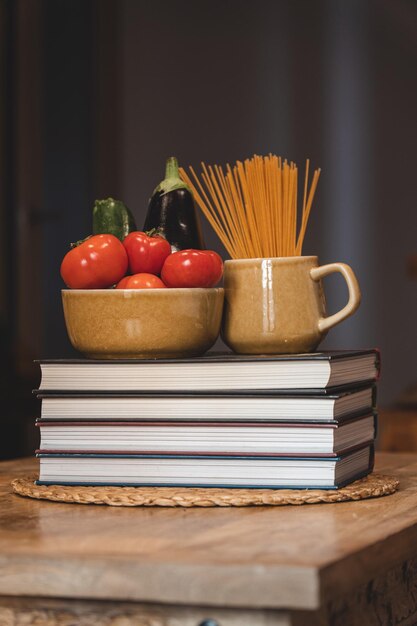 Food inside cups on books