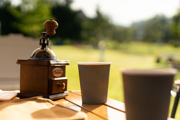 Food lover at Camping Dripping coffee during camping at natural lake and mountain view background