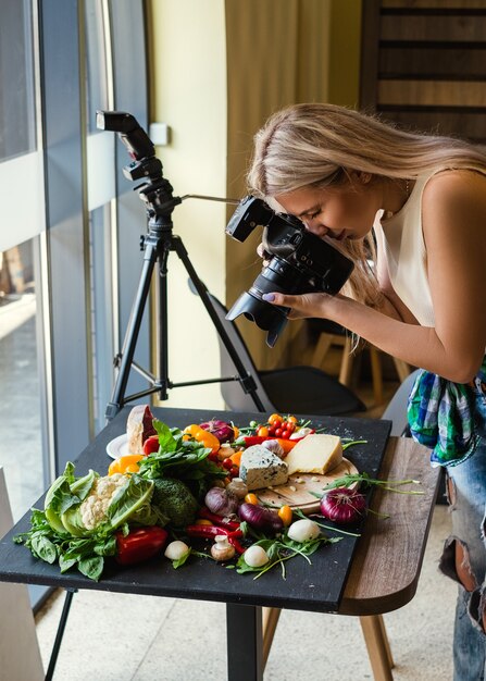 Food photographer at work. Modern equipment to make quality photos. Creativity art hobby leisure concept