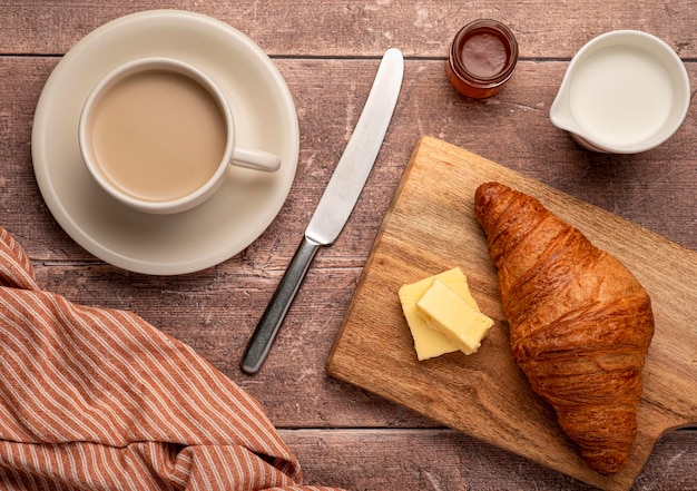 Food photography of breakfast croissant and cappuccino