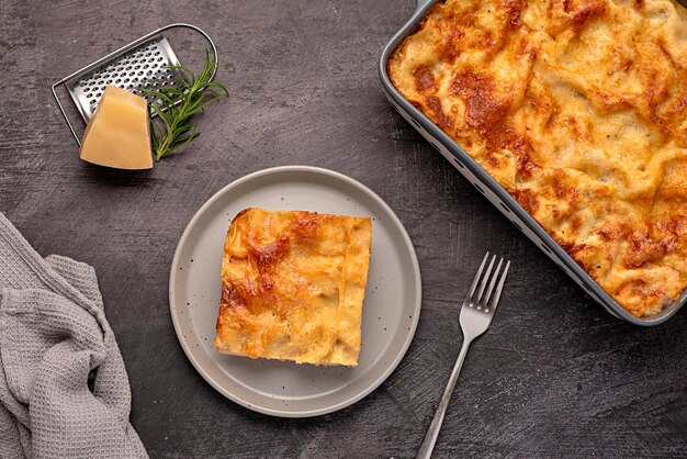 Food photography of lasagna casserole cheese tomato sauce parmesan stand ground italian pasta