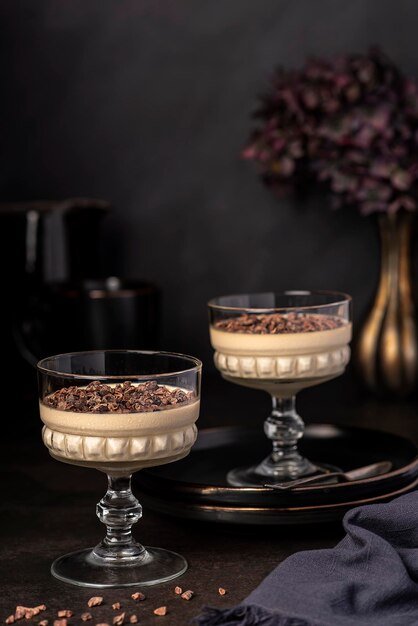 Food photography of panna cotta and chocolate nibs