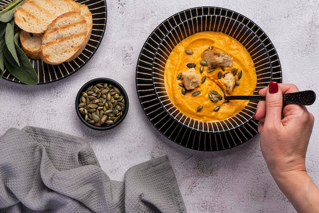 Food photography of pumpkin soup toasts and seeds