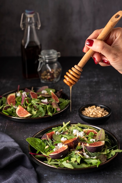 Food photography of salad with goat cheese figs and honey