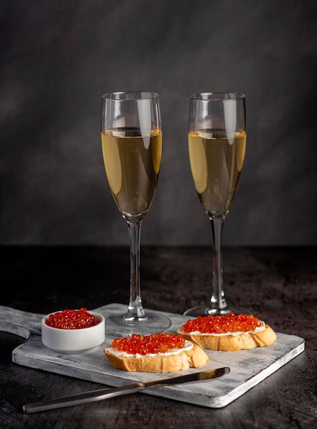 Food photography of sandwich with caviar and wine