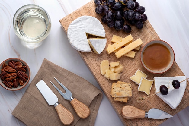 Food photography of white wine cheese grape crackers