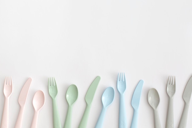 Food plastic cutlery on white background. Concept of Recycling plastic and ecology.