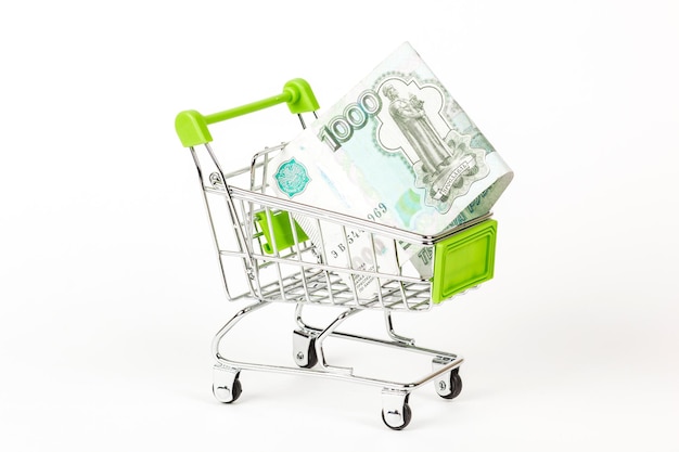 Food trolley full of Russian 1000 banknotes On a white background