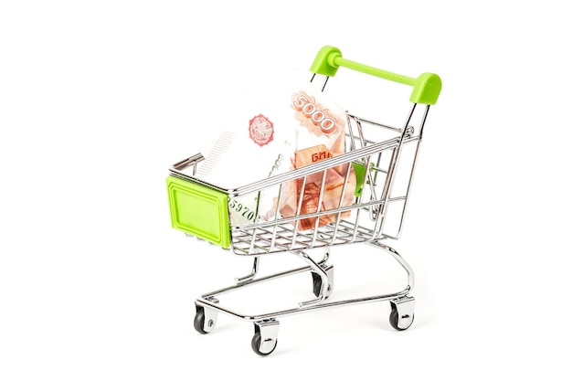 Food trolley full of Russian 5000 banknotes On a white background