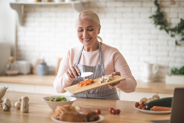 Food vlogger preparing a vegetable dish in her cooking vlog