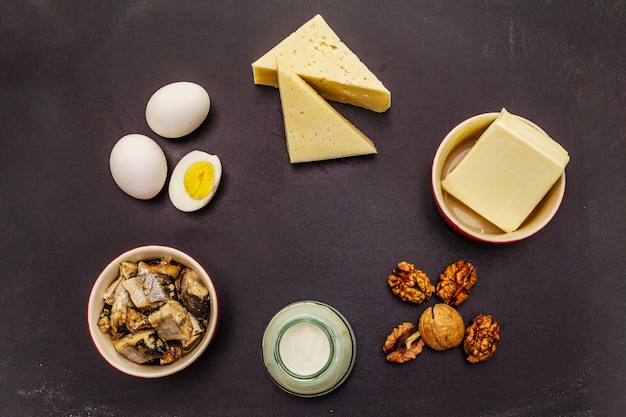 Photo foods containing vitamin d. cheese, eggs, butter, nuts, milk, sardine