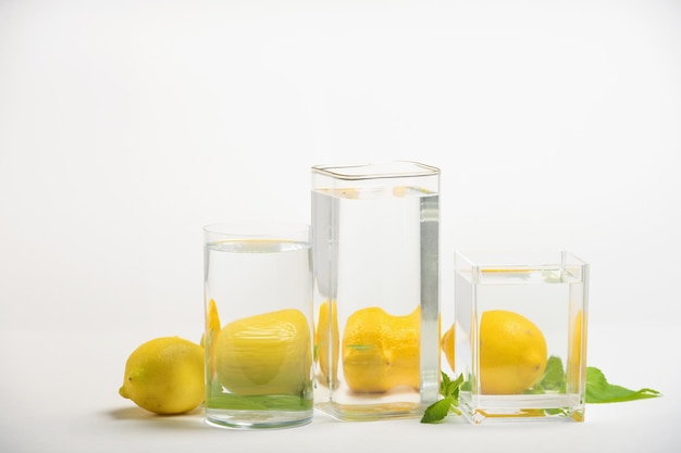 Foods distorted through liquid and glass on white background