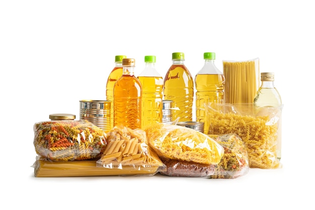 Foodstuff for donation storage and delivery on white background with clipping path Various food pasta cooking oil and canned food