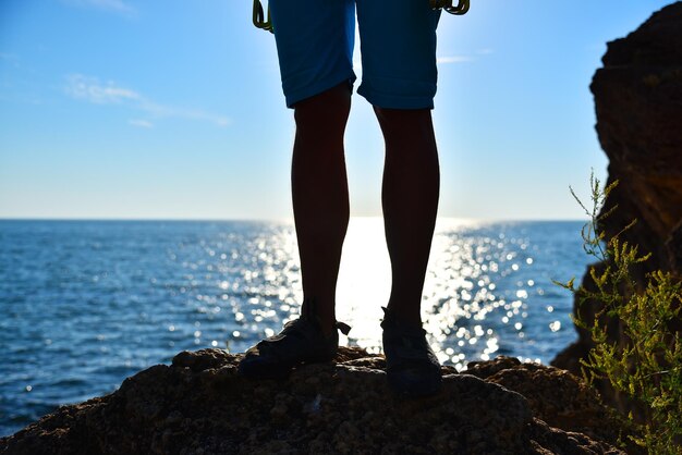 Foot climber on a cliff