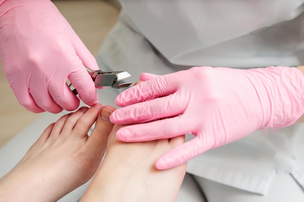 Foot massage in the spa salon.Woman in a beauty salon for pedicure and foot massage.