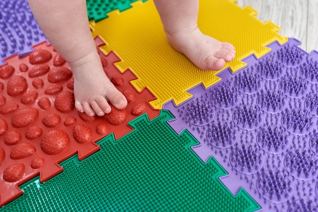 Foot massager Kid walking on a orthopedic massage mat Treatment and prevention of flat feet in children