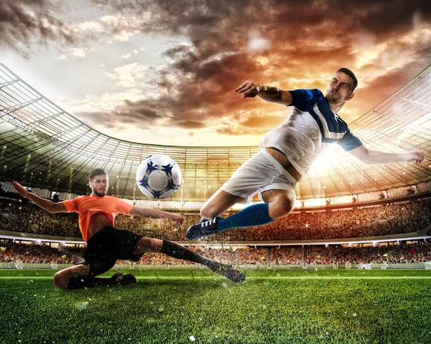 Football action scene with competing players at the stadium